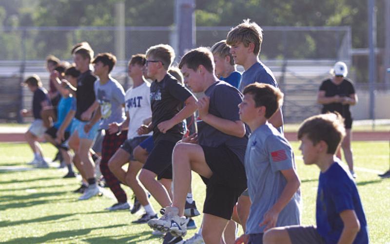 HUNTER KING | DISPATCH RECORD Young Badgers put in work on the high school football field last week.