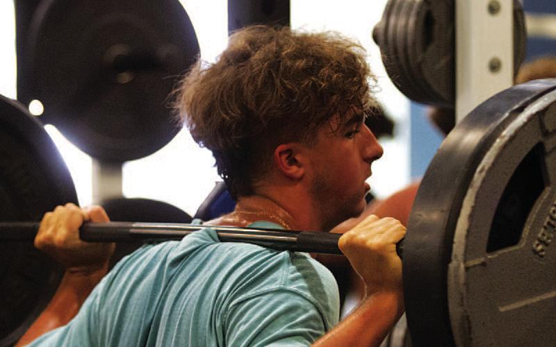 Landon Richardson gets in one of his last lifts of SWAT workouts. HUNTER KING | DISPATCH RECORD