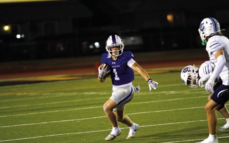 Kayden Van Pelt looks for room to run against Canyon West Plains. HUNTER KING | DISPATCH RECORD