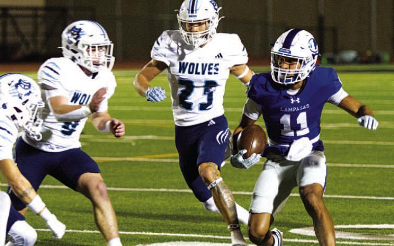 Jaden McElwain is surrounded by Wolves defenders during last Friday’s contest. HUNTER KING | DISPATCH RECORD
