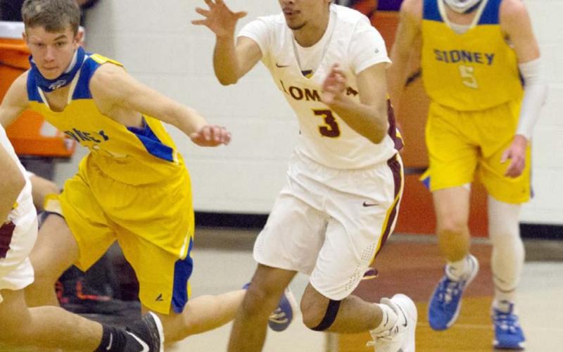 Alonso Caso (3) passes the ball on a fast break in the Lometa Hornets’ bi-district victory over Sidney on Saturday. JEFF LOWE | DISPATCH RECORD