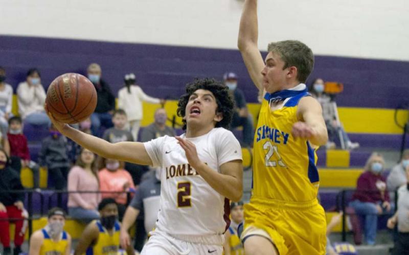 Tim Juarez, left, goes for a layup in the Hornets’ 49-31 first-round playoff win. See related photo, page A8. JEFF LOWE | DISPATCH RECORD