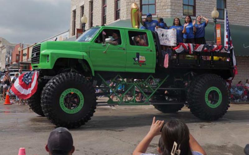 R&amp;amp;R Roofing’s lifted truck was not the traditional parade float, but it was a crowd favorite. ADAM BARRIOS | DISPATCH RECORD