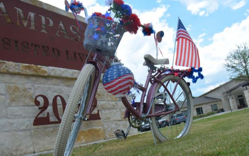 Staff at Lampasas Assisted Living honored the late Spring Ho ambassador Janie Brown Perkins by decorating a bike similar to what she rode each year in the annual parade. MONIIQUE BRAND | DISPATCH RECORD