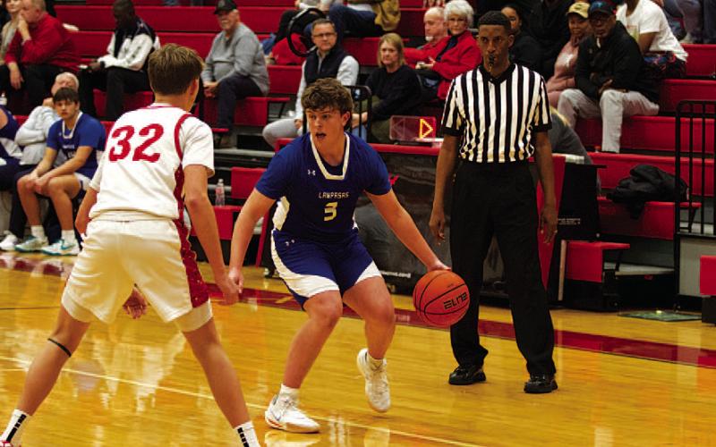 Aidan Nuckles sizes up a defender during the Badgers’ game on Tuesday night. HUNTER KING | DISPATCH RECORD