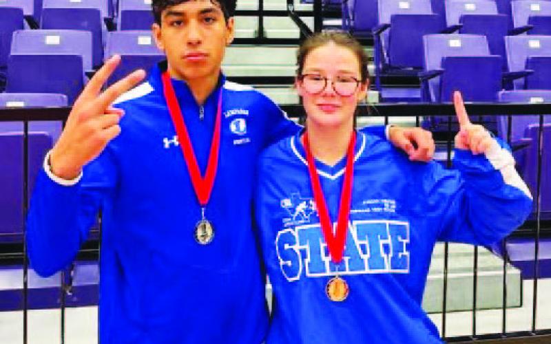 COURTESY PHOTO Kaiden Fernandez, left, and Jordan Winfree pose with their medals from the first tournament.
