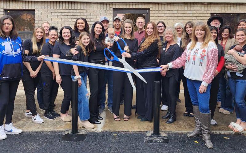 Radiance Clinical Research celebrated its first anniversary Dec. 13 with an open house and ribbon-cutting event. Dr. Vanna Gold and Mia Monroe hold the ceremonial scissors, with colleague Lauren Garner standing to their left. The three women are co-owners of the medical facility, located at 207 West Avenue E in Lampasas.