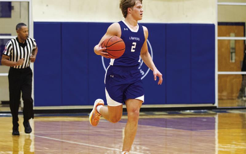 Haegan Oncken dribbles up the floor during the Badgers’ game against Jarrell. HUNTER KING | DISPATCH RECORD