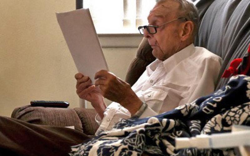 The late Ray Fitzgerald reads through the manuscript “The Soul of a Cowboy.” He was a top hand, a poet, served our country as a Marine and treated his horses well. joycesarah mccabe | dispatch record