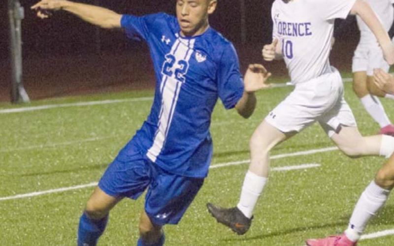 Cruz Lucio (22) moves the ball against the Florence defense. JEFF LOWE | DISPATCH RECORD
