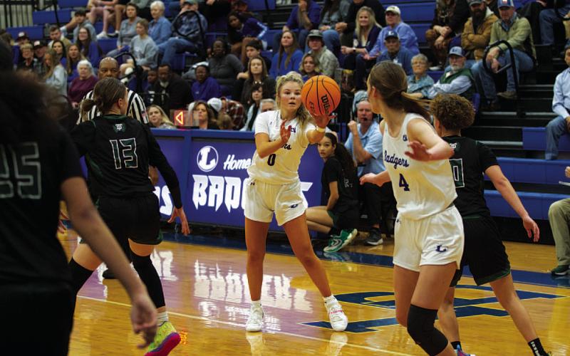 Addison Borchardt fires a pass to Lainey Dixon during last Friday’s game against Taylor. HUNTER KING | DISPATCH RECORD