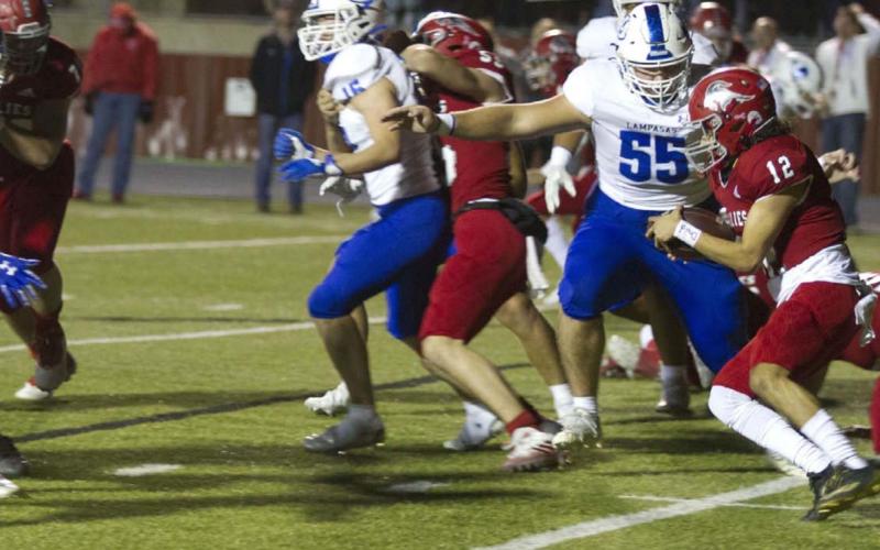 Conner Keele prepares to make a tackle on the Fredericksburg ball carrier Jesse Leija during last week’s contest. HUNTER KING | DISPATCH RECORD