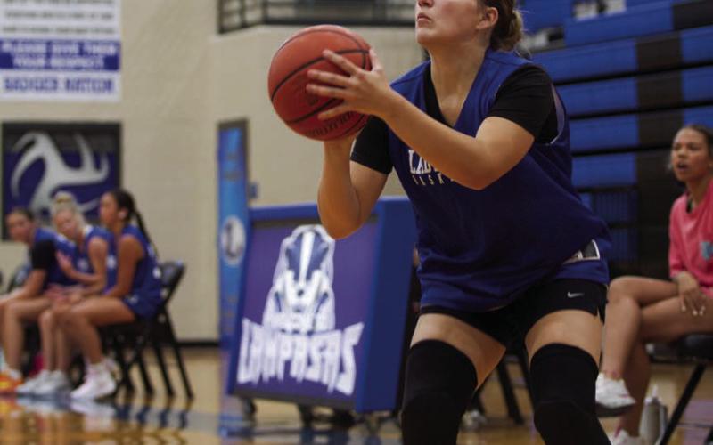 Payton Crawford lines up a three pointer during Monday’s summer league game against Burnet. The Lady Badgers captured a convincing 50-17 victory. ERICK MITCHELL | DISPATCH RECORD