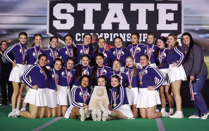The cheer team poses with their trophy and medals after finishing third at the state competition in Fort Worth. COURTESY PHOTO