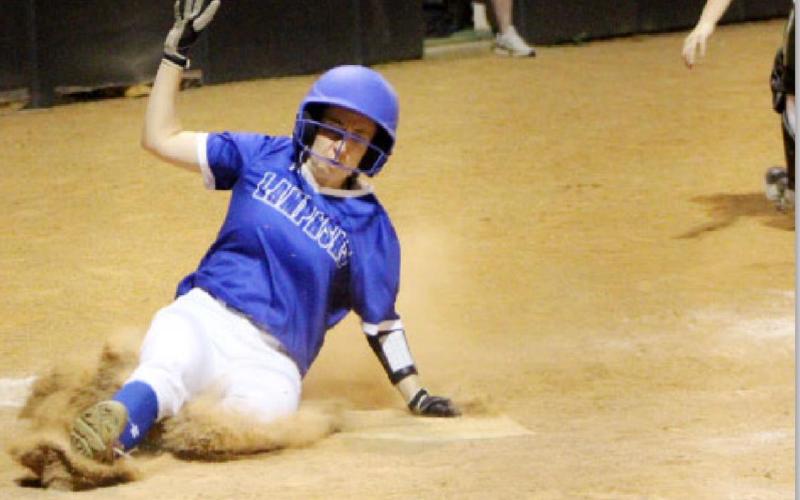 Lady Badger senior outfielder Rose McAnally slides home for a run in Tuesday’s game at Burnet. DONNA MCANALLY | COURTESY PHOTO