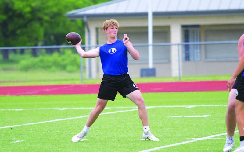 Ross Kothmann throws a pass during team workouts on Wednesday afternoon. HUNTER KING | DISPATCH RECORD