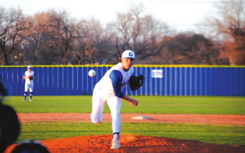 Tak Stinnett tosses a pitch on his way to completing seven full innings to beat Brownwood on Tuesday night. HUNTER KING | DISPATCH RECORD