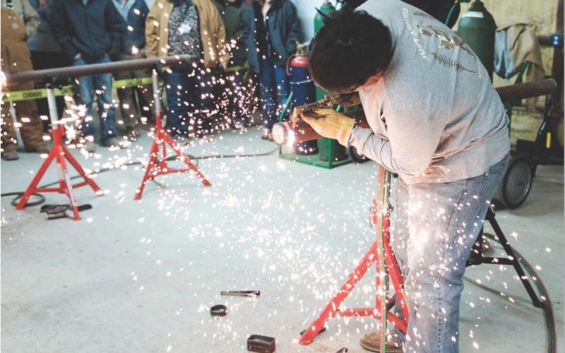 GABRIELA SANGACHE| DISPATCH RECORD Connor Alexander participates in the Fastest Torch competition for Ag Mechanics students on Emmanuel Prado competes in a time-based welding challenge. Wednesday evening.