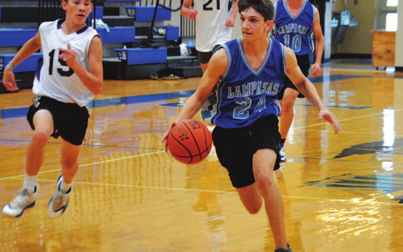 Luke Shivers dribbles to the basket for a layup during the Badgers’ first summer game against San Saba. HUNTER KING | DISPATCH RECORD