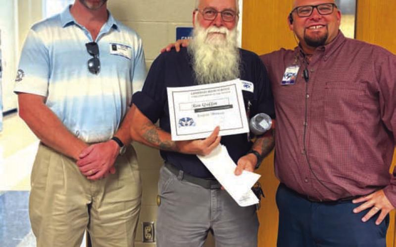 LHS has named Ronald Griffin, in center, as its Star Supporter of the Month. Griffin is head custodian at the campus. Assistant Principal Ryan Race, at right, said Griffin exemplifies a strong work ethic and takes pride in the school. Also pictured is Clay Phillips of Texas Farm Bureau Insurance, who helped honor Griffin. COURTESY PHOTO