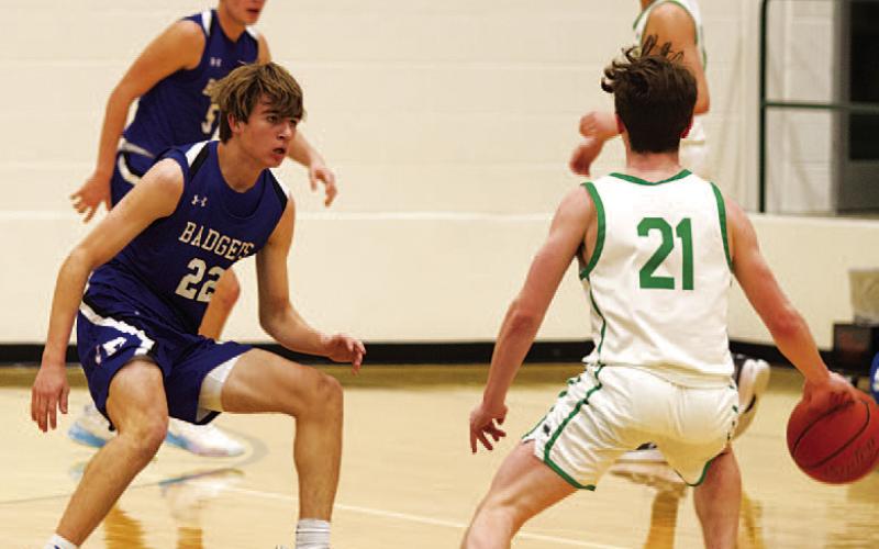 HUNTER KING | DISPATCH RECORD Jax Pratus defends the Burnet ball handler during Tuesday’s win over the Bulldogs.