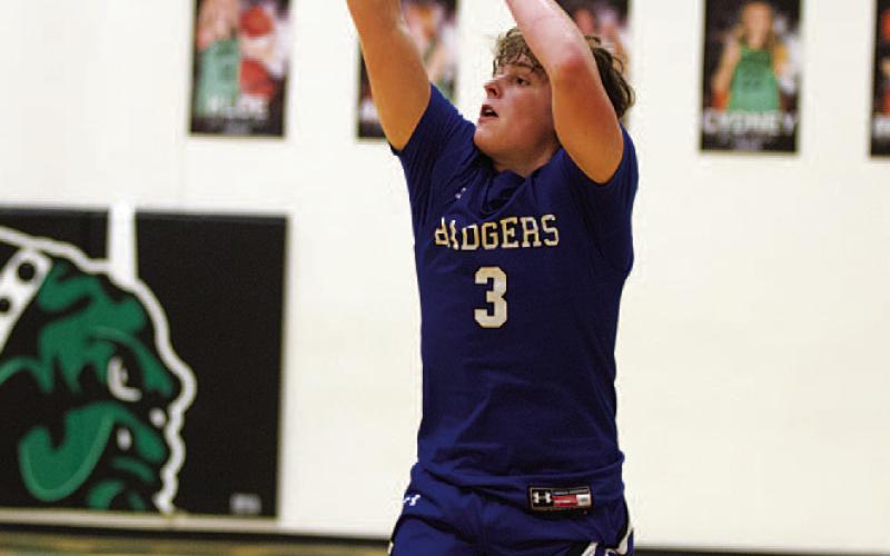 HUNTER KING | DISPATCH RECORD Aidan Nuckles knocks down a deep three during the fourth quarter.