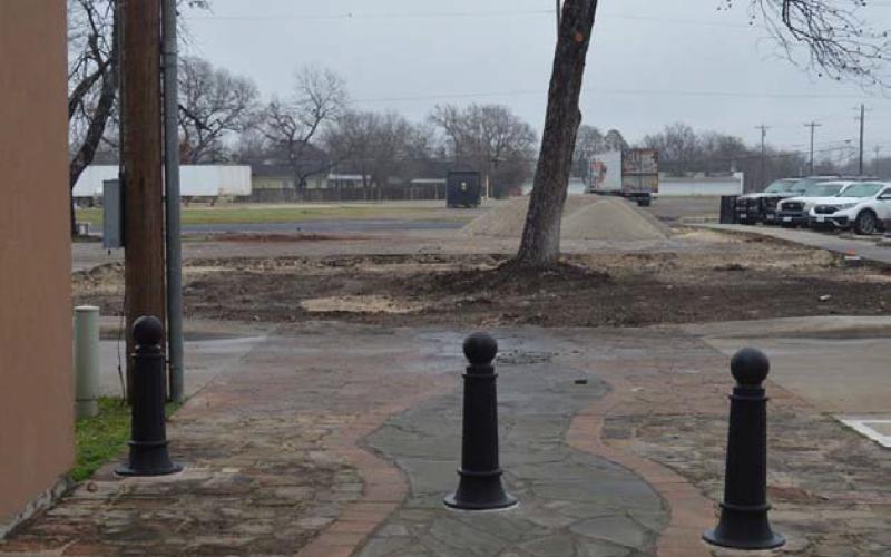 An empty space can be seen behind the Lampasas County Office Buildings, the former site of the pocket park. A future county-owned storage building will soon fill the space. ERICK MITCHELL | DISPATCH RECORD