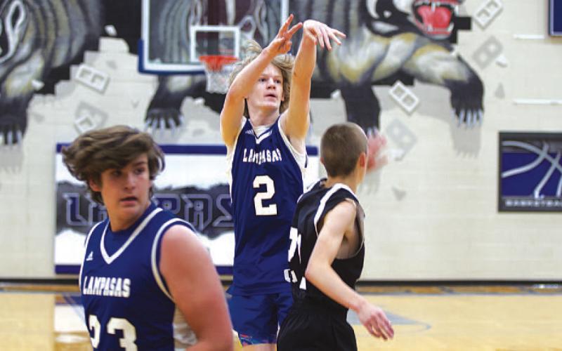Peyton Sisson shoots over a Hamilton defender. The incoming sophomore shot the ball well on Monday. HUNTER KING | DISPATCH RECORD