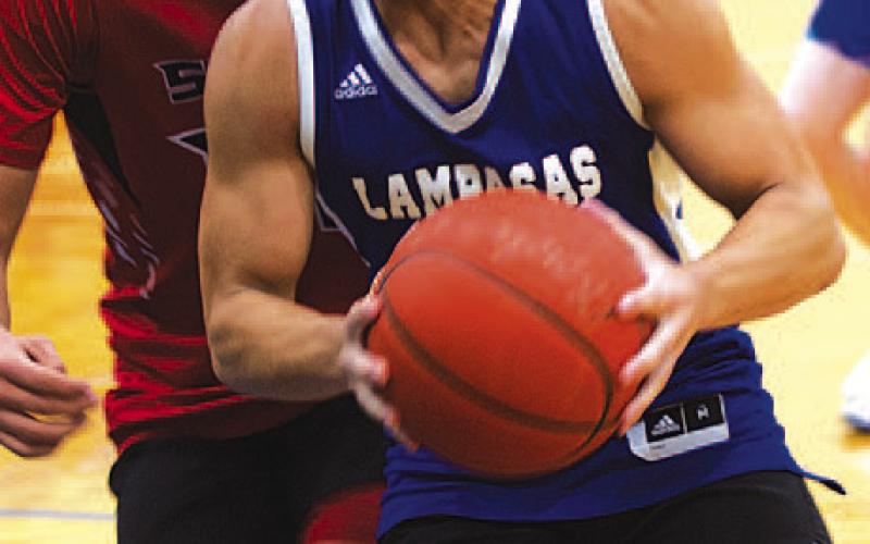 HUNTER KING | DISPATCH RECORD KJ Reed drives past a Salado defender in the paint.