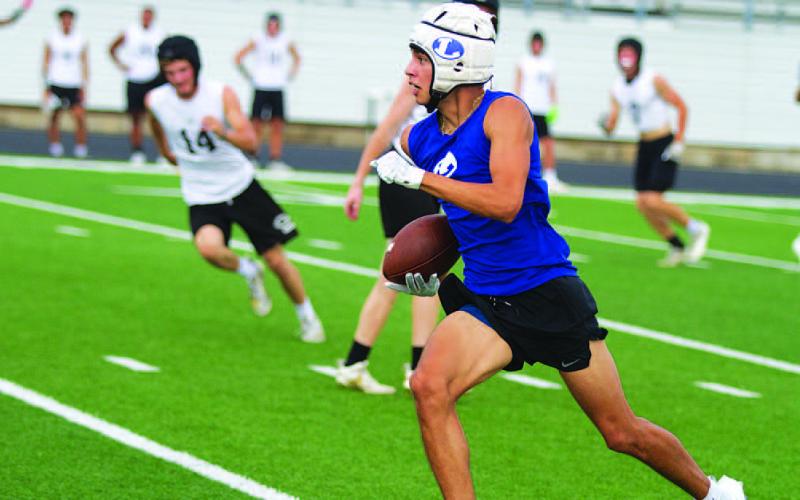 Jonah Sanchez runs up field after catching a pass during 7-on-7. HUNTER KING | DISPATCH RECORD