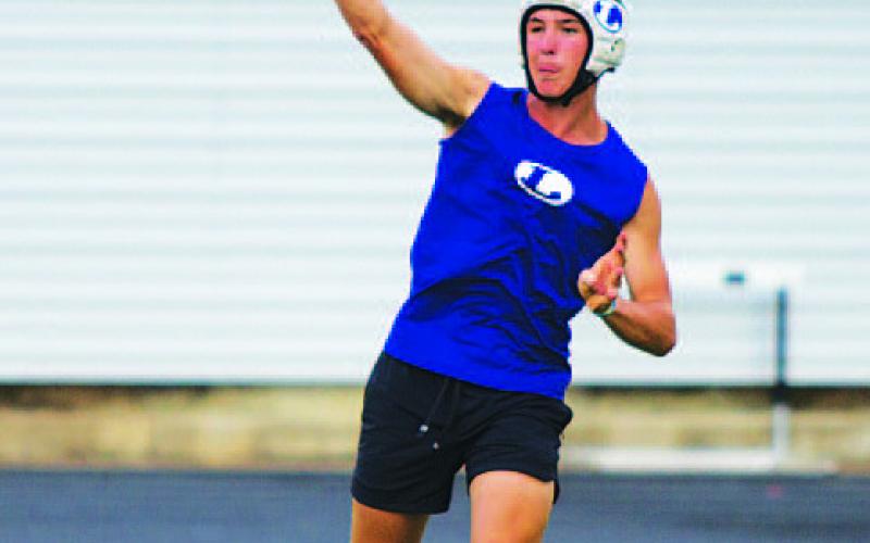HUNTER KING | DISPATCH RECORD JT Posten releases a throw.