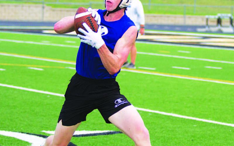 HUNTER KING | DISPATCH RECORD Cale Wheeler makes a catch along the sideline.