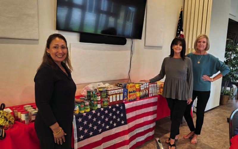 From left are Jo Ann San Miguel, Sherry Gillen-Milligan and Cathy Allen, who prepared Thanksgiving baskets from The ’36 Club. COURTESY PHOTO