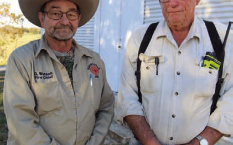 Adamsville Volunteer Fire Chief Dean Watson and Larry Straley, left to right, pose for a photo at the 55th Annual Deer Hunter’s Bar-B-Que on Saturday. JOYCESARAH MCCABE | DISPATCH RECORD
