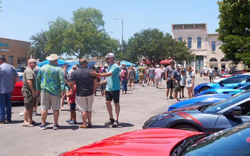 ADAM BARRIOS | DISPATCH RECORD Crowds stroll the courthouse square to view classic, vintage and antique cars from nearly every decade.