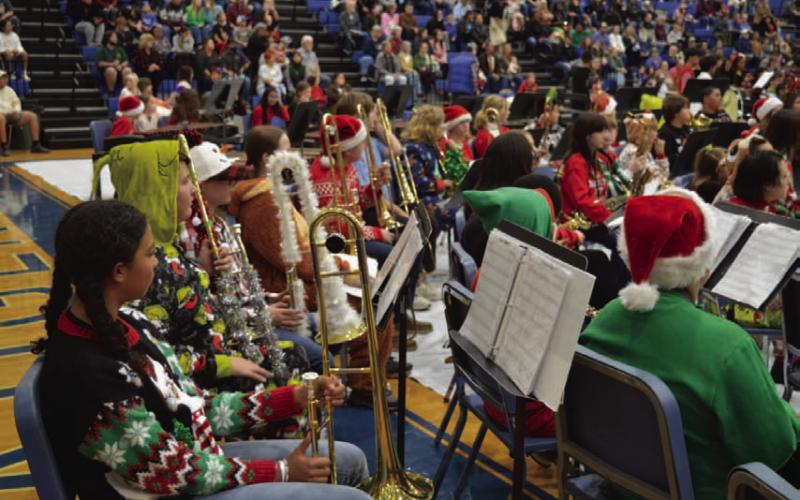Lampasas Middle School Beginner Band members in festive Christmas attire wait their turn to perform. ERICK MITCHELL| DISPATCH RECORD