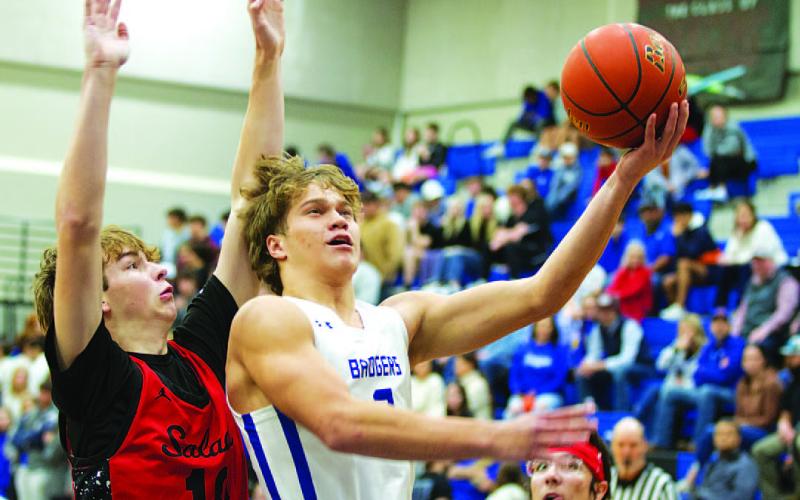 HUNTER KING | DISPATCH RECORD Haegan Oncken goes up to finish through contact from a Salado defender.