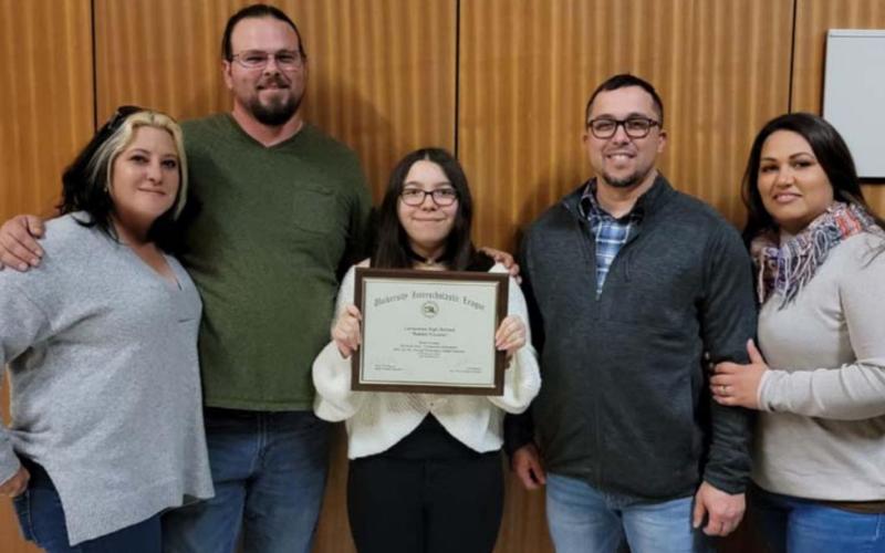 Lampasas High School student Katlyn Greer, center, displays the certificate she garnered for fourth place in traditional animation with her “Rabbit Trouble” entry. Pictured with her are, from left, Diona Jentsch and Joshua Jentsch, and Leonard Nunez and Mandy Nunez. COURTESY PHOTO