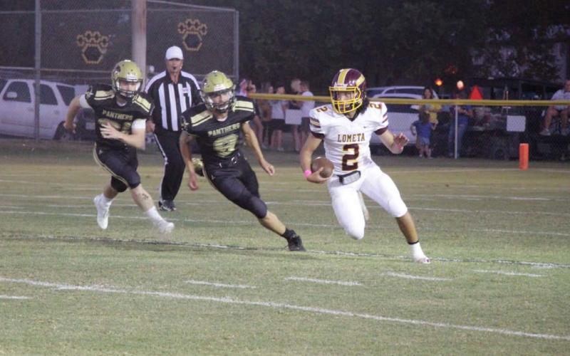 Tim Juarez runs past Abbott defenders during the game last Friday. JESSICA MALDONADO | DISPATCH RECORD