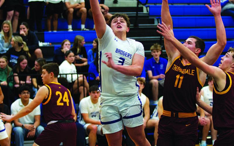 Aidan Nuckles goes up for a layup against Thorndale. He led the Badgers in scoring in the contest. HUNTER KING | DISPATCH RECORD