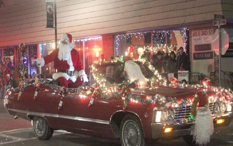 Santa is expected to ride in style for this year’s Holidazzle Lighted Christmas Parade, as he did in previous parades through downtown Lampasas. The jolly old man will be available Saturday from 3-4 p.m. at the Ajinomoto Foods lobby, 601 E. Third St., for photos before he joins the parade later in the evening. FILE PHOTO