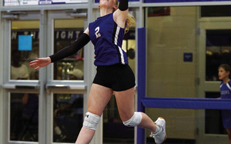 HUNTER KING | DISPATCH RECORD Ellie Felkner leaps for a serve against McGregor.
