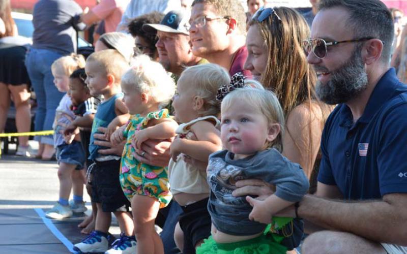 ALEXANDRIA RANDOLPH | DISPATCH RECORD Toddler handlers line up their 16- to 19-month-old race contestants during the annual Spring Ho Diaper Derby on Friday. Results can be found below.