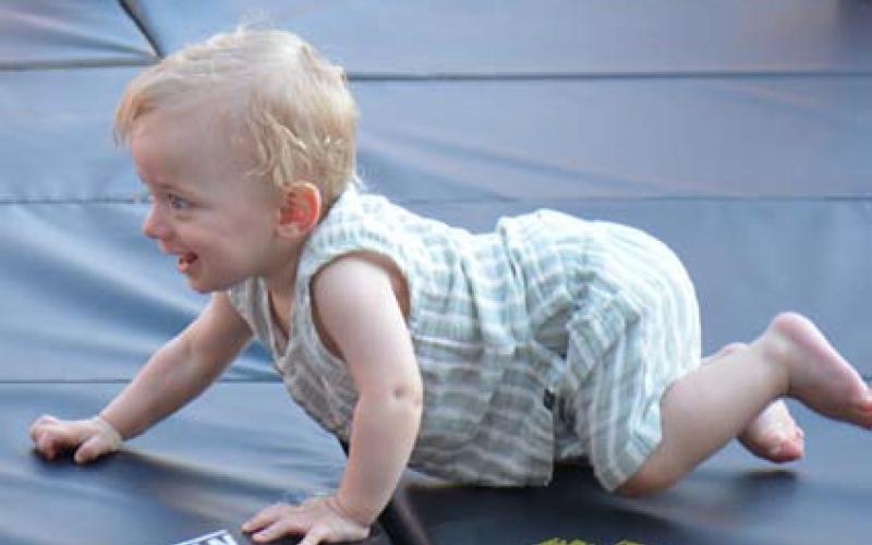 Holden Henderson has his eyes on the prize (a bag of snacks) at the end of the finish line. He took second place in heat two for crawlers up to nine months old. ALEXANDRIA RANDOLPH | DISPATCH RECORD