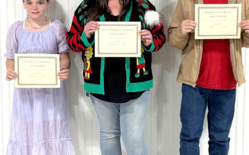 Ivy Hubbard, left, and Vance Weems, right, were recognized as students of the month for December. Crystal Bell, center, and Sarah Coker, not pictured, were named staff of the month. COURTESY PHOTO?