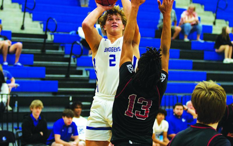 HUNTER KING | DISPATCH RECORD Haegan Oncken shoots over an outstretched defender against Marble Falls Faith Academy.