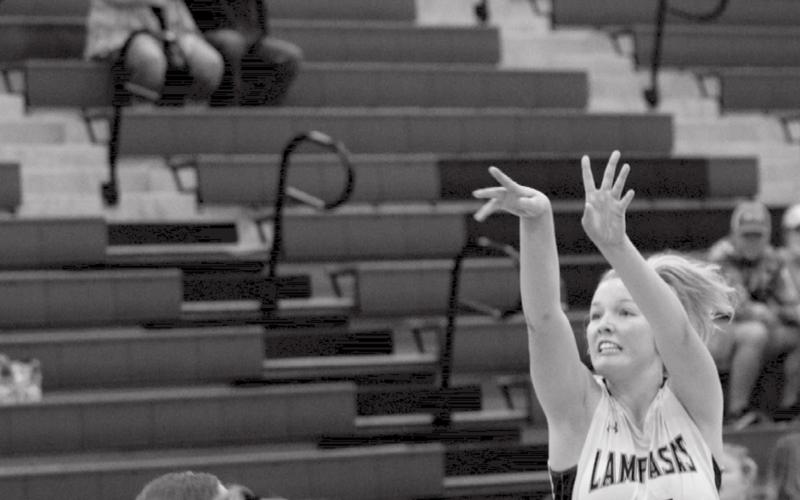 Laurcy Bender makes her second three-pointer of Saturday’s win over Academy. JEFF LOWE | DISPATCH RECORD