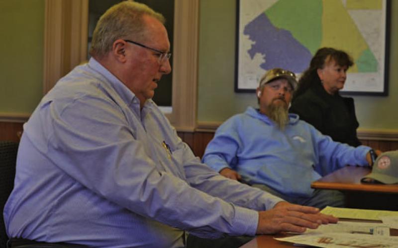 Dan Johnson, at left, attended the Commissioners Court workshop to answer questions about the RKJ Construction bid for courthouse renovation work. He serves as vice president of the local firm. ERICK MITCHELL | DISPATCH RECORD