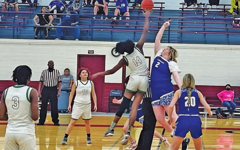 Morgan Lovejoy goes up for the opening tip during a game in the Edgewood tournament over the weekend. Also pictured is Cobie Chandler. COURTESY PHOTO