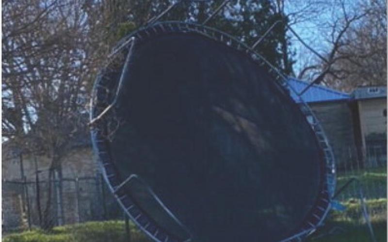 Trampolines were the big losers in the battle against gusty winds on Monday. Olivia Moreno sent this photo of a trampoline turned upside down and smashed up against the fence. COURTESY PHOTO